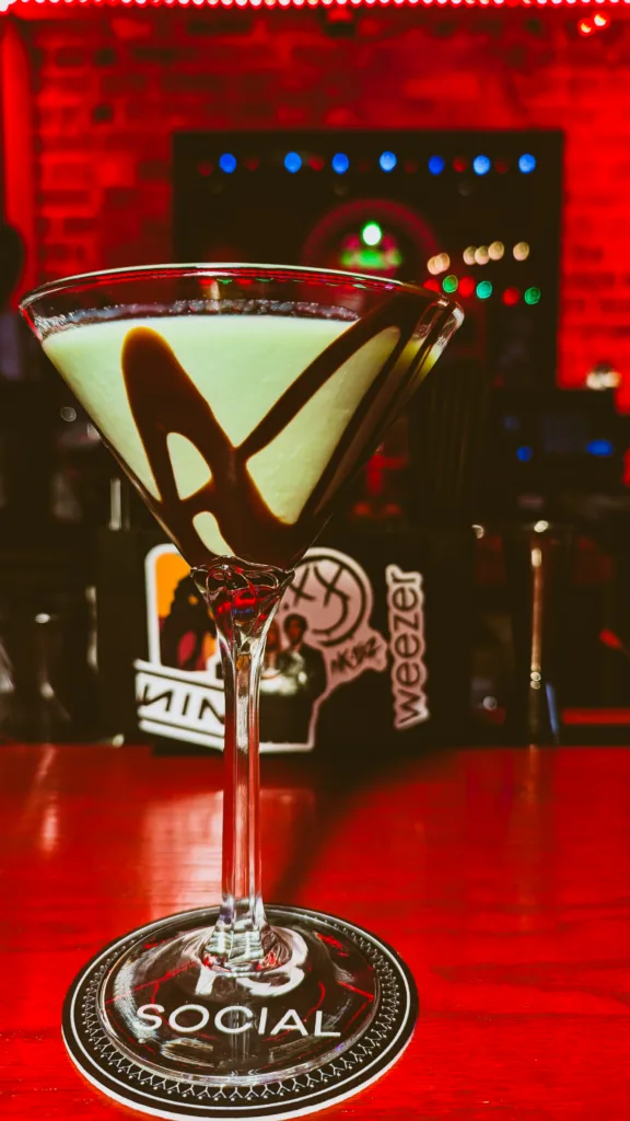 A Mint Chocolate martini on a bar top.